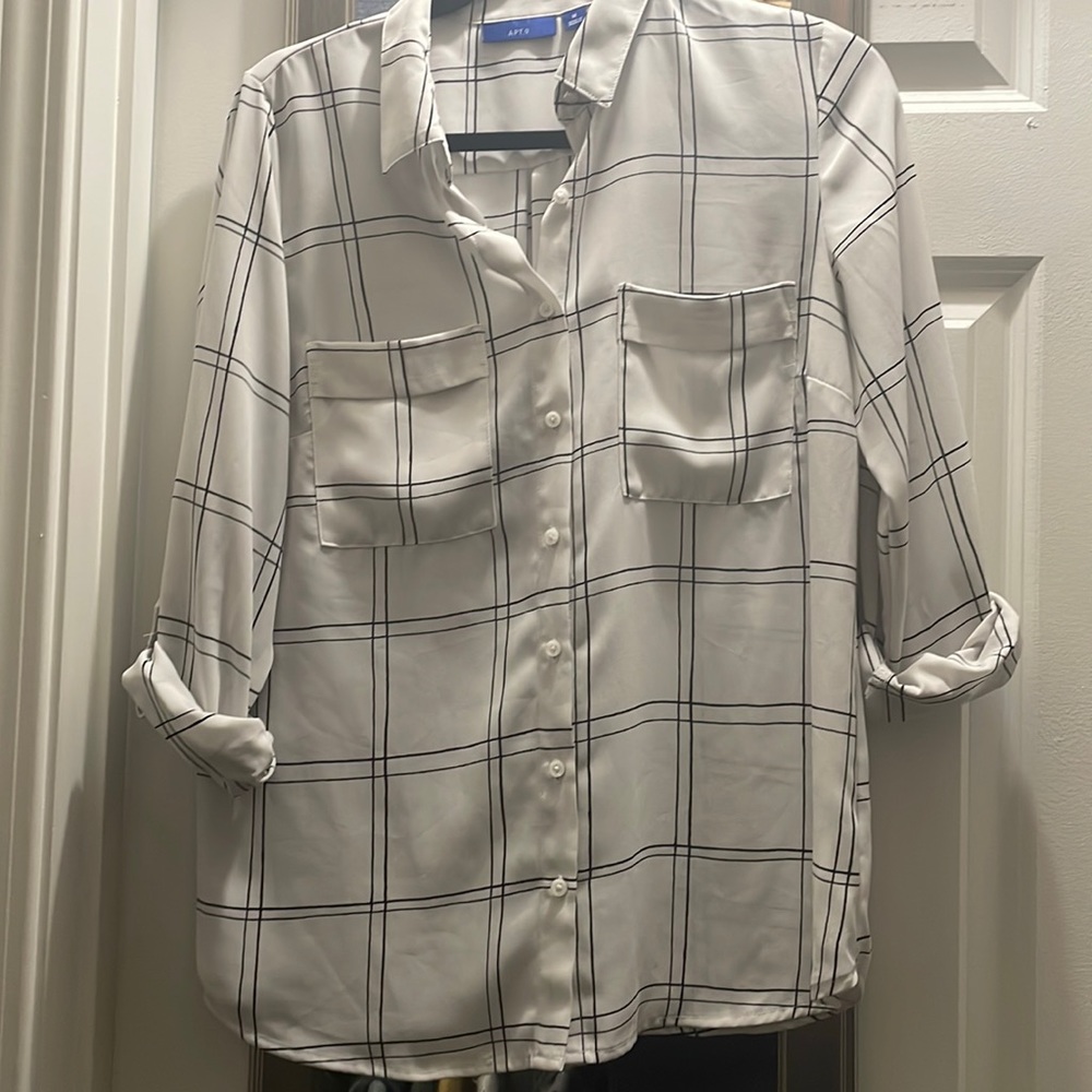 White long sleeve button up with black plaid and double breast pocket.